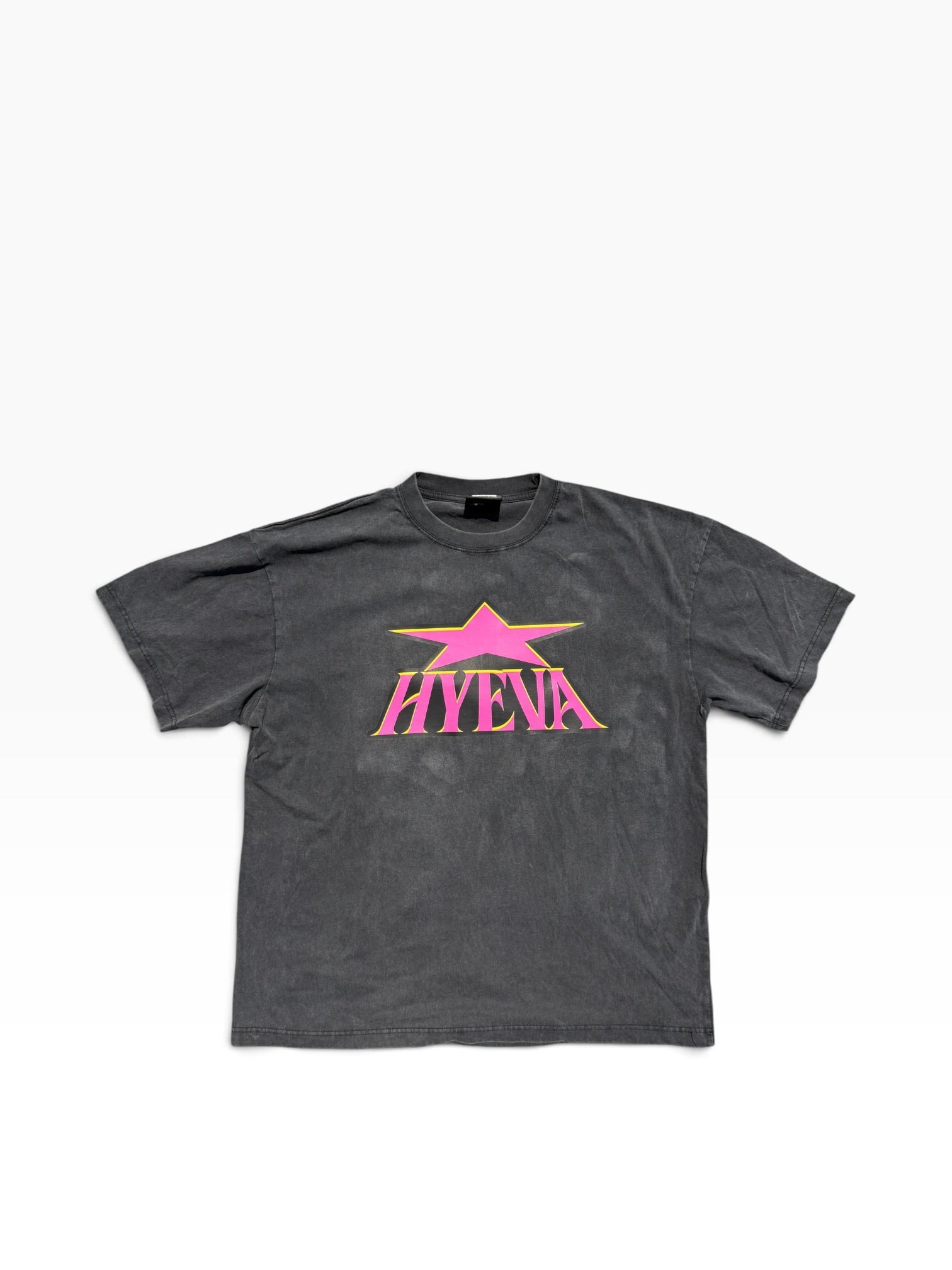 Hyeva 90s Skatepunk Tee with hot pink logo on a faded black boxy T-shirt