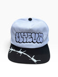 No Trespassing Snapback with white crown, black barbed-wire bill, and throw-up graphic